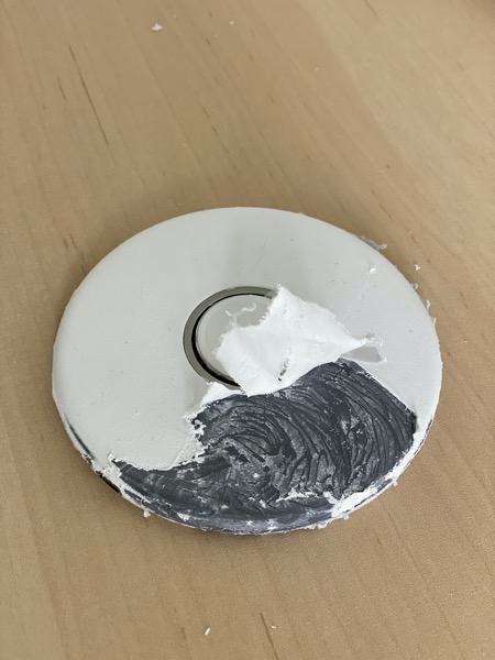 Charging dock with fabric partially peeled away