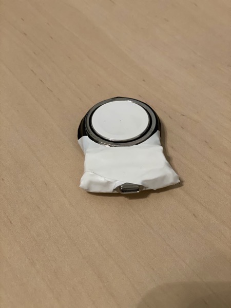 Charging puck held together with lots of electrical tape